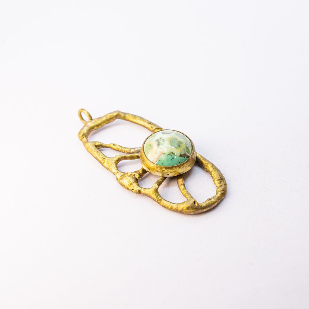 Brass charm